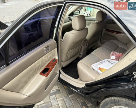 Черный Тойота Камри, объемом двигателя 2.4 л и пробегом 326 тыс. км за 6300 $, фото 11 на Automoto.ua