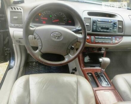 Чорний Тойота Камрі, об'ємом двигуна 3 л та пробігом 208 тис. км за 6700 $, фото 4 на Automoto.ua