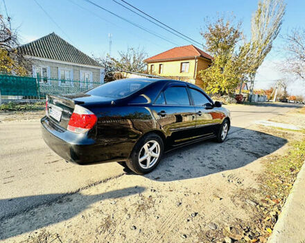 Черный Тойота Камри, объемом двигателя 2.4 л и пробегом 253 тыс. км за 6100 $, фото 1 на Automoto.ua