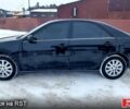 Черный Тойота Камри, объемом двигателя 2.4 л и пробегом 345 тыс. км за 4700 $, фото 1 на Automoto.ua