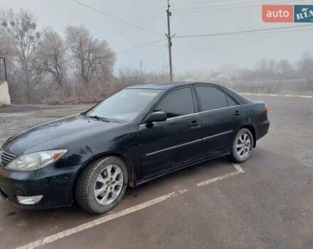 Чорний Тойота Камрі, об'ємом двигуна 3 л та пробігом 267 тис. км за 7500 $, фото 1 на Automoto.ua