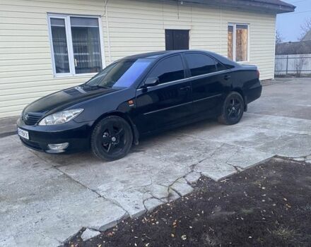 Черный Тойота Камри, объемом двигателя 2.4 л и пробегом 300 тыс. км за 7500 $, фото 7 на Automoto.ua