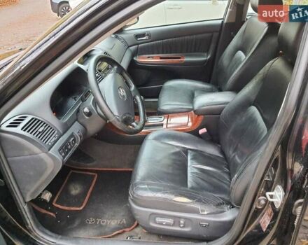 Чорний Тойота Камрі, об'ємом двигуна 3 л та пробігом 218 тис. км за 6400 $, фото 7 на Automoto.ua