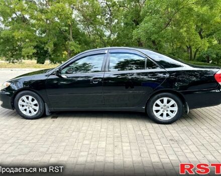 Черный Тойота Камри, объемом двигателя 3 л и пробегом 300 тыс. км за 6200 $, фото 2 на Automoto.ua