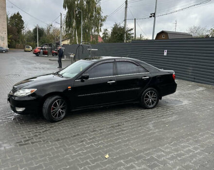 Чорний Тойота Камрі, об'ємом двигуна 2.4 л та пробігом 292 тис. км за 5350 $, фото 3 на Automoto.ua