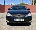 Черный Тойота Камри, объемом двигателя 2.4 л и пробегом 310 тыс. км за 5000 $, фото 1 на Automoto.ua