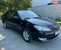 Чорний Тойота Камрі, об'ємом двигуна 2.4 л та пробігом 267 тис. км за 6900 $, фото 2 на Automoto.ua