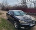 Черный Тойота Камри, объемом двигателя 2.36 л и пробегом 400 тыс. км за 7200 $, фото 1 на Automoto.ua