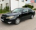 Черный Тойота Камри, объемом двигателя 2.4 л и пробегом 281 тыс. км за 3999 $, фото 1 на Automoto.ua