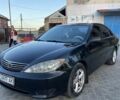 Чорний Тойота Камрі, об'ємом двигуна 2.4 л та пробігом 320 тис. км за 5600 $, фото 1 на Automoto.ua