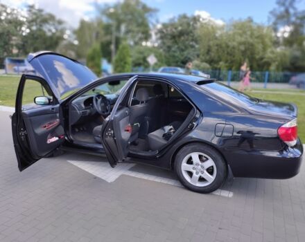 Черный Тойота Камри, объемом двигателя 2.4 л и пробегом 310 тыс. км за 6000 $, фото 1 на Automoto.ua
