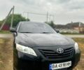 Чорний Тойота Камрі, об'ємом двигуна 2.4 л та пробігом 380 тис. км за 7499 $, фото 1 на Automoto.ua