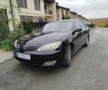 Чорний Тойота Камрі, об'ємом двигуна 2.4 л та пробігом 220 тис. км за 5800 $, фото 1 на Automoto.ua