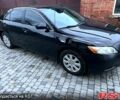 Черный Тойота Камри, объемом двигателя 2.4 л и пробегом 245 тыс. км за 7500 $, фото 1 на Automoto.ua