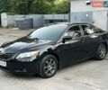 Черный Тойота Камри, объемом двигателя 2.4 л и пробегом 260 тыс. км за 7300 $, фото 1 на Automoto.ua
