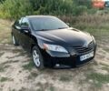 Черный Тойота Камри, объемом двигателя 2.4 л и пробегом 350 тыс. км за 7100 $, фото 1 на Automoto.ua