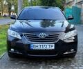 Черный Тойота Камри, объемом двигателя 2.4 л и пробегом 200 тыс. км за 8500 $, фото 1 на Automoto.ua