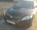 Черный Тойота Камри, объемом двигателя 2.4 л и пробегом 250 тыс. км за 7574 $, фото 1 на Automoto.ua
