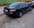 Черный Тойота Камри, объемом двигателя 2.4 л и пробегом 263 тыс. км за 7900 $, фото 1 на Automoto.ua