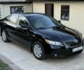 Черный Тойота Камри, объемом двигателя 2.4 л и пробегом 243 тыс. км за 8298 $, фото 1 на Automoto.ua