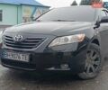 Черный Тойота Камри, объемом двигателя 2.4 л и пробегом 242 тыс. км за 7500 $, фото 1 на Automoto.ua