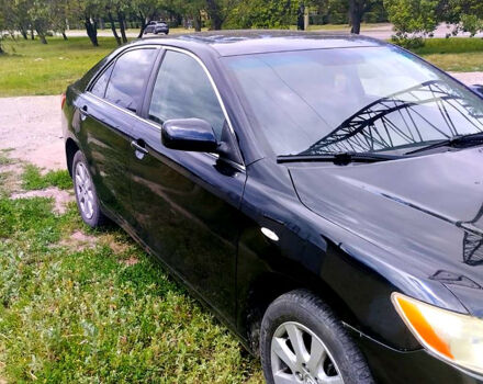 Черный Тойота Камри, объемом двигателя 2.4 л и пробегом 250 тыс. км за 6799 $, фото 1 на Automoto.ua