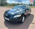 Черный Тойота Камри, объемом двигателя 2.4 л и пробегом 300 тыс. км за 7800 $, фото 1 на Automoto.ua