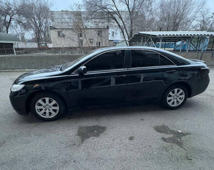 Черный Тойота Камри, объемом двигателя 2.36 л и пробегом 357 тыс. км за 6900 $, фото 1 на Automoto.ua