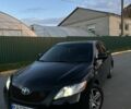 Черный Тойота Камри, объемом двигателя 2.4 л и пробегом 300 тыс. км за 7500 $, фото 1 на Automoto.ua