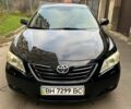 Черный Тойота Камри, объемом двигателя 2.4 л и пробегом 257 тыс. км за 8650 $, фото 1 на Automoto.ua