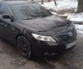 Черный Тойота Камри, объемом двигателя 2.5 л и пробегом 252 тыс. км за 9150 $, фото 1 на Automoto.ua