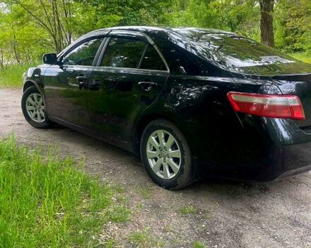 Черный Тойота Камри, объемом двигателя 2.4 л и пробегом 320 тыс. км за 7500 $, фото 1 на Automoto.ua