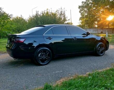 Чорний Тойота Камрі, об'ємом двигуна 2.4 л та пробігом 235 тис. км за 8700 $, фото 1 на Automoto.ua