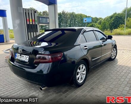 Черный Тойота Камри, объемом двигателя 2.4 л и пробегом 320 тыс. км за 8000 $, фото 1 на Automoto.ua