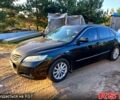 Черный Тойота Камри, объемом двигателя 2.4 л и пробегом 220 тыс. км за 8500 $, фото 1 на Automoto.ua