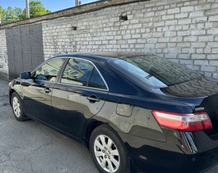 Черный Тойота Камри, объемом двигателя 2.4 л и пробегом 176 тыс. км за 9000 $, фото 1 на Automoto.ua