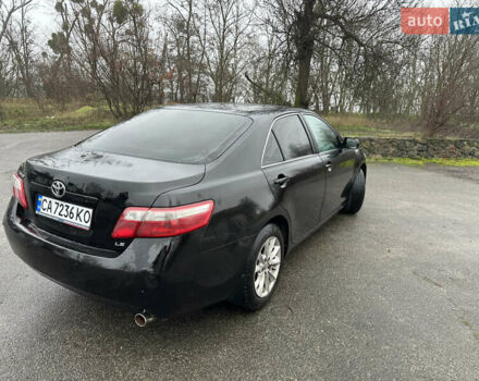 Черный Тойота Камри, объемом двигателя 2.4 л и пробегом 232 тыс. км за 6850 $, фото 6 на Automoto.ua