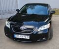 Чорний Тойота Камрі, об'ємом двигуна 2.4 л та пробігом 126 тис. км за 10650 $, фото 1 на Automoto.ua