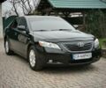 Черный Тойота Камри, объемом двигателя 2.36 л и пробегом 225 тыс. км за 9990 $, фото 1 на Automoto.ua