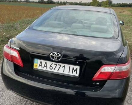 Черный Тойота Камри, объемом двигателя 2.4 л и пробегом 202 тыс. км за 9700 $, фото 1 на Automoto.ua