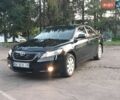 Чорний Тойота Камрі, об'ємом двигуна 2.4 л та пробігом 205 тис. км за 6999 $, фото 1 на Automoto.ua