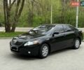 Черный Тойота Камри, объемом двигателя 2.4 л и пробегом 311 тыс. км за 8500 $, фото 1 на Automoto.ua