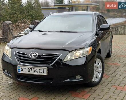 Черный Тойота Камри, объемом двигателя 2.4 л и пробегом 238 тыс. км за 7699 $, фото 1 на Automoto.ua