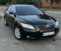 Черный Тойота Камри, объемом двигателя 2.4 л и пробегом 215 тыс. км за 10500 $, фото 1 на Automoto.ua