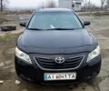 Черный Тойота Камри, объемом двигателя 2.4 л и пробегом 290 тыс. км за 9000 $, фото 1 на Automoto.ua