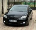 Черный Тойота Камри, объемом двигателя 2.4 л и пробегом 231 тыс. км за 9000 $, фото 1 на Automoto.ua