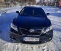 Чорний Тойота Камрі, об'ємом двигуна 2.4 л та пробігом 240 тис. км за 10300 $, фото 1 на Automoto.ua