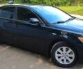Чорний Тойота Камрі, об'ємом двигуна 2.4 л та пробігом 126 тис. км за 10650 $, фото 1 на Automoto.ua
