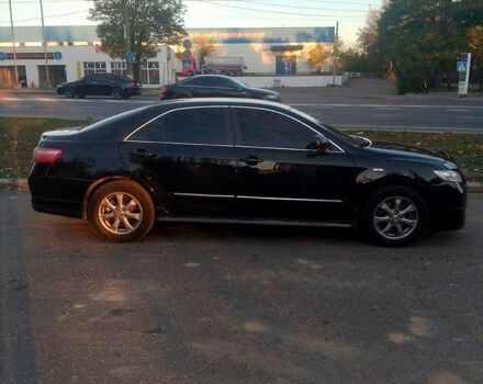 Черный Тойота Камри, объемом двигателя 2.4 л и пробегом 322 тыс. км за 7000 $, фото 1 на Automoto.ua