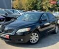 Черный Тойота Камри, объемом двигателя 2.4 л и пробегом 247 тыс. км за 9490 $, фото 1 на Automoto.ua